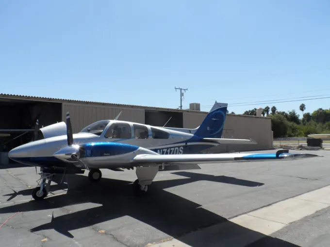 Blue-and-white single-engine aircraft
