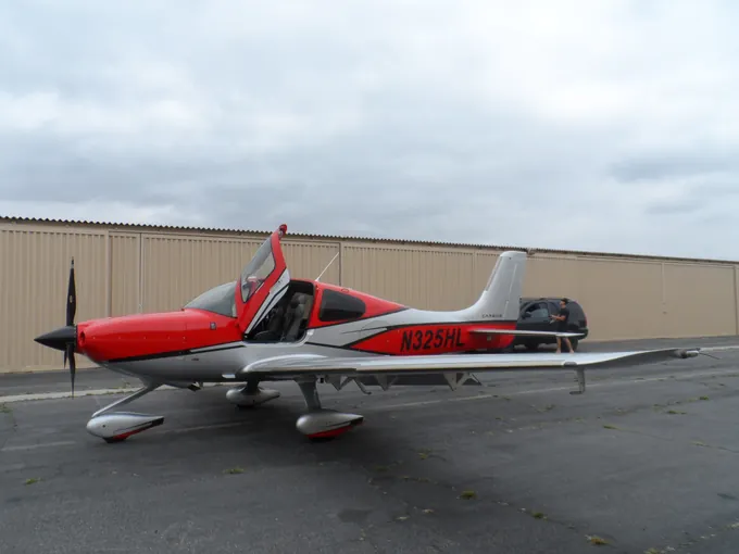 Red, silver and black light aircraft