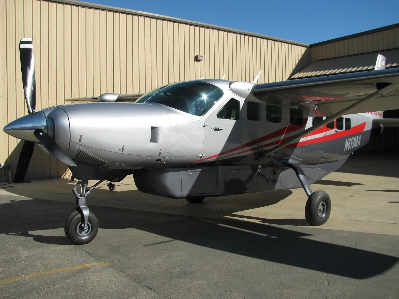 Silver Cessna Caravan with red accent stripes