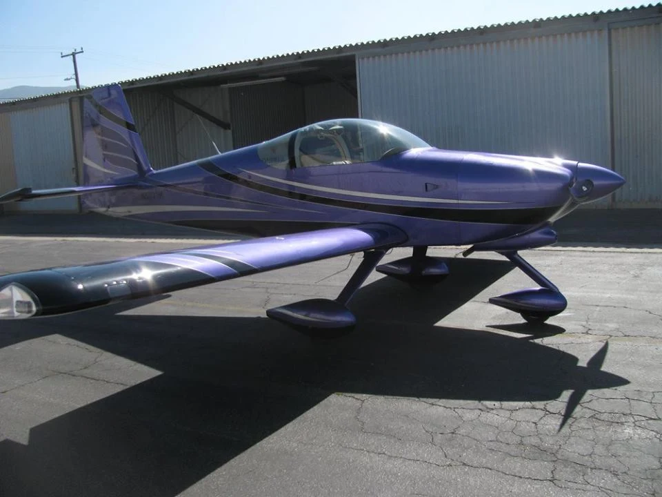 Purple piston aircraft with silver custom graphics